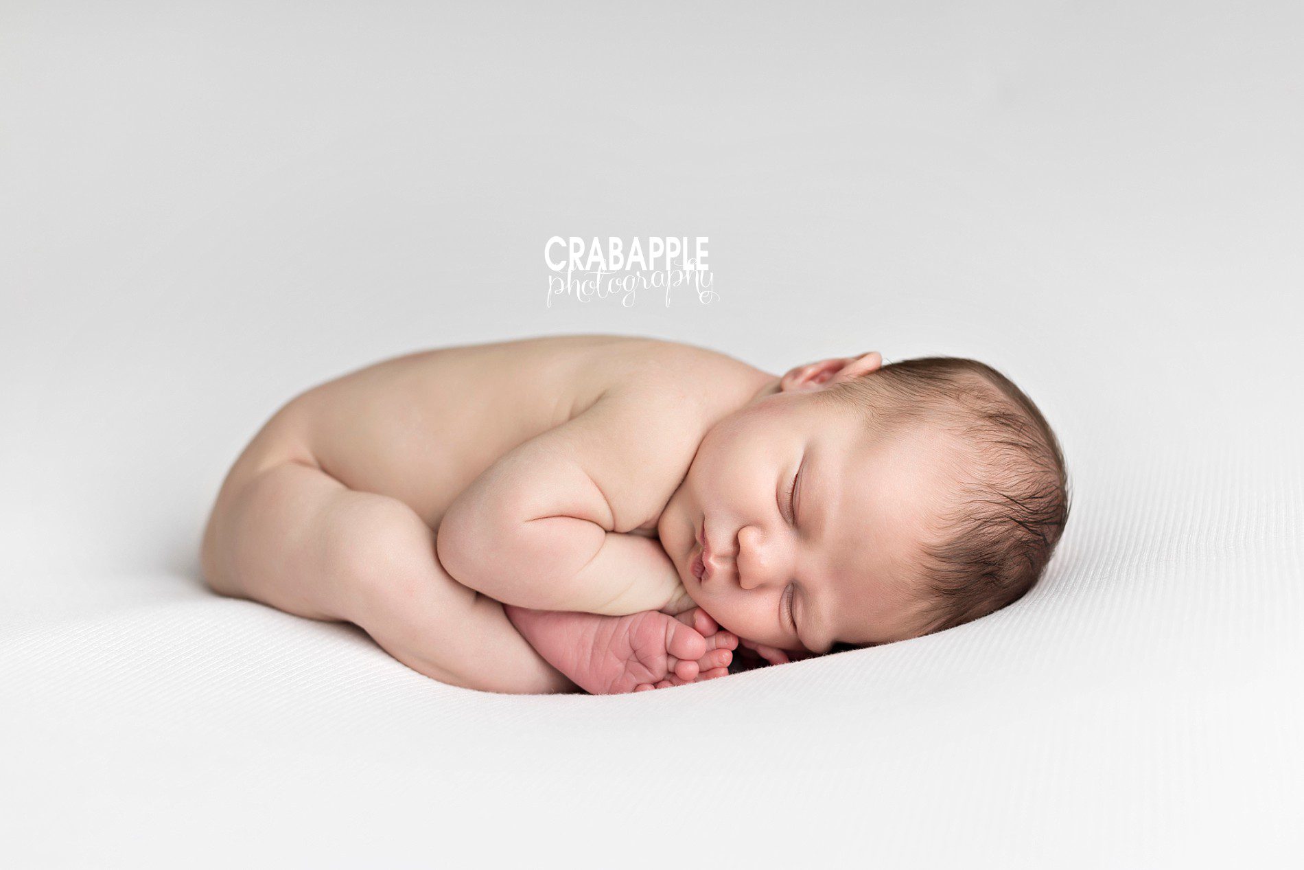 folded over baby pose. pose ideas for newborn pictures