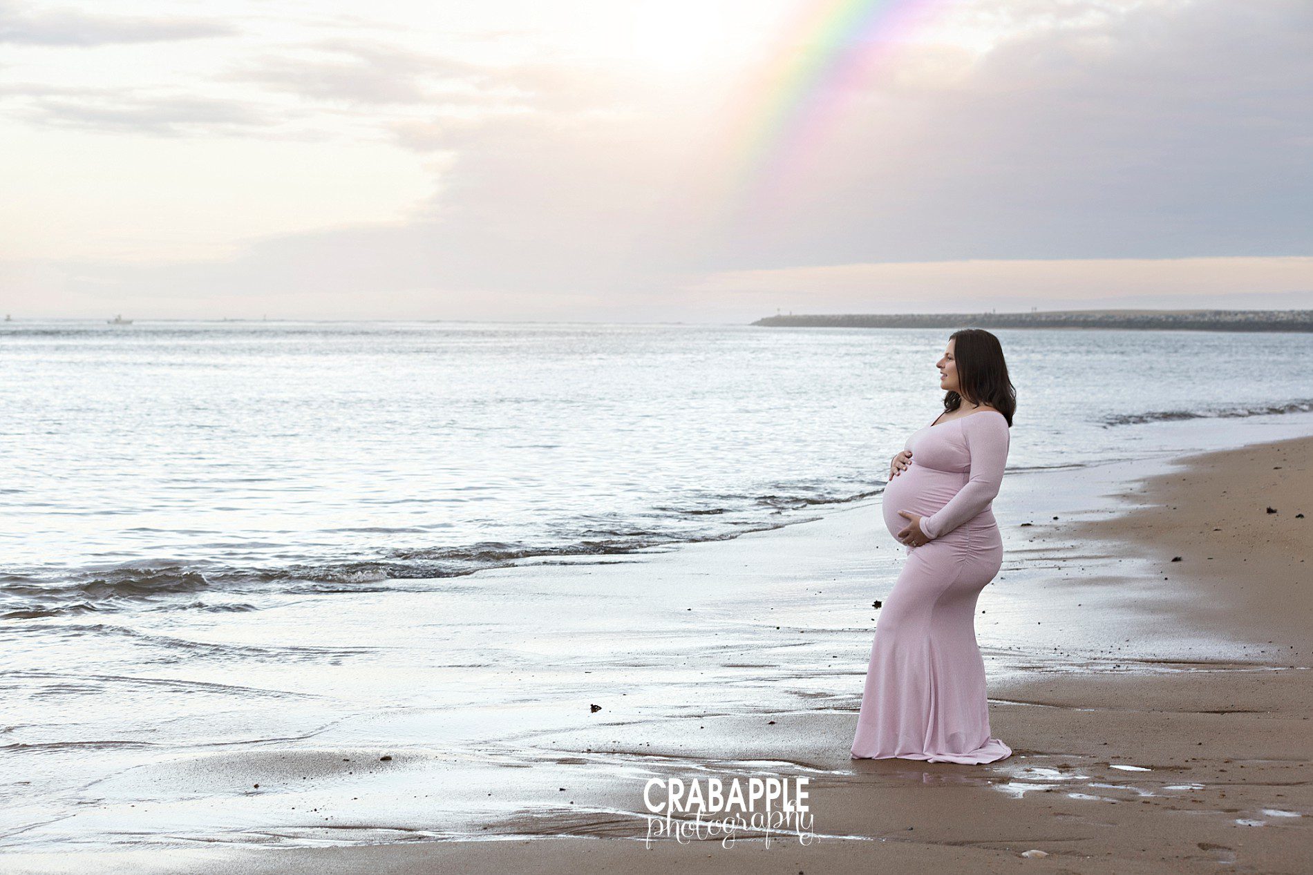 beautiful maternity portraits at the beach with rainbow
