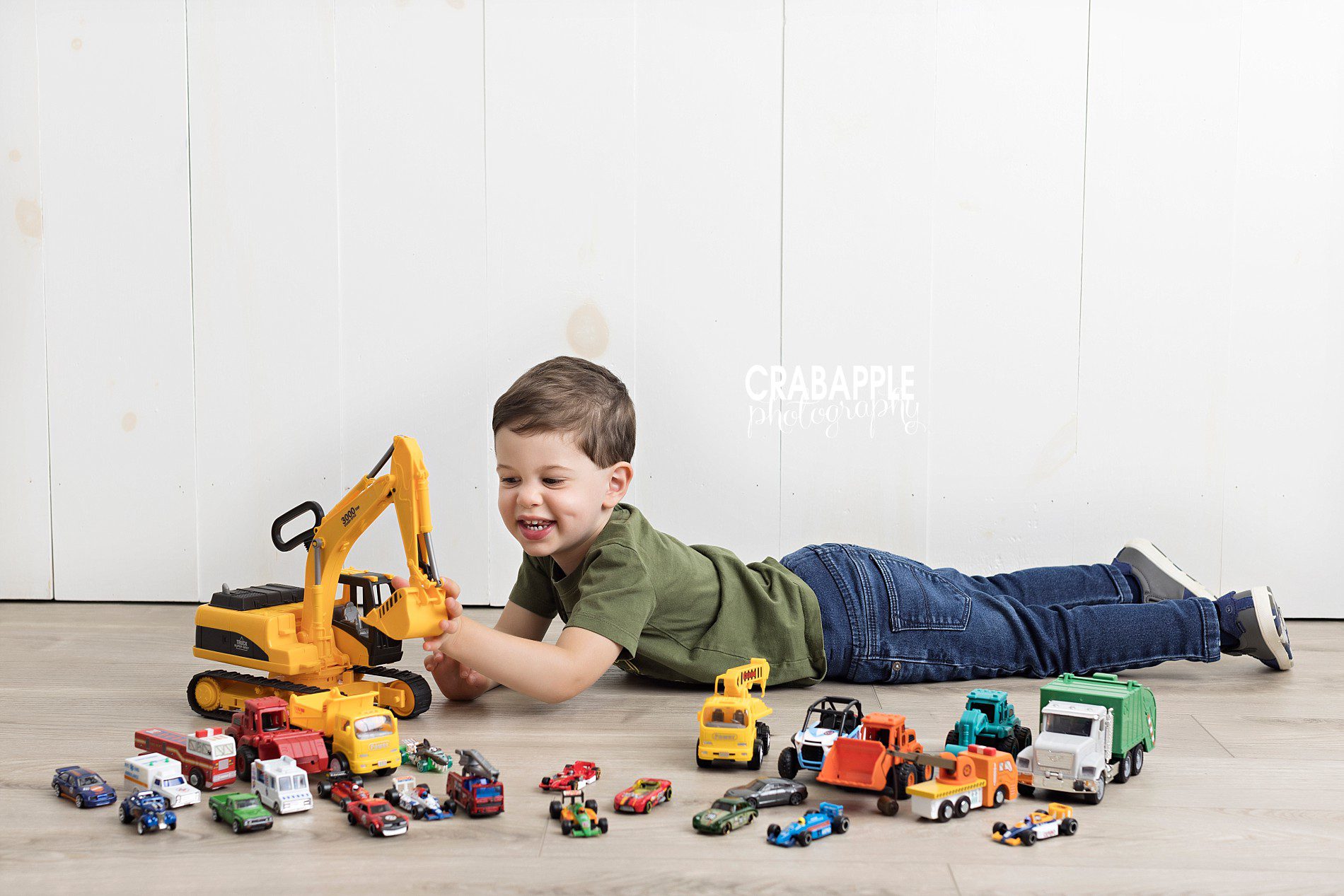 toddler portrait ideas using toy trucks and cars