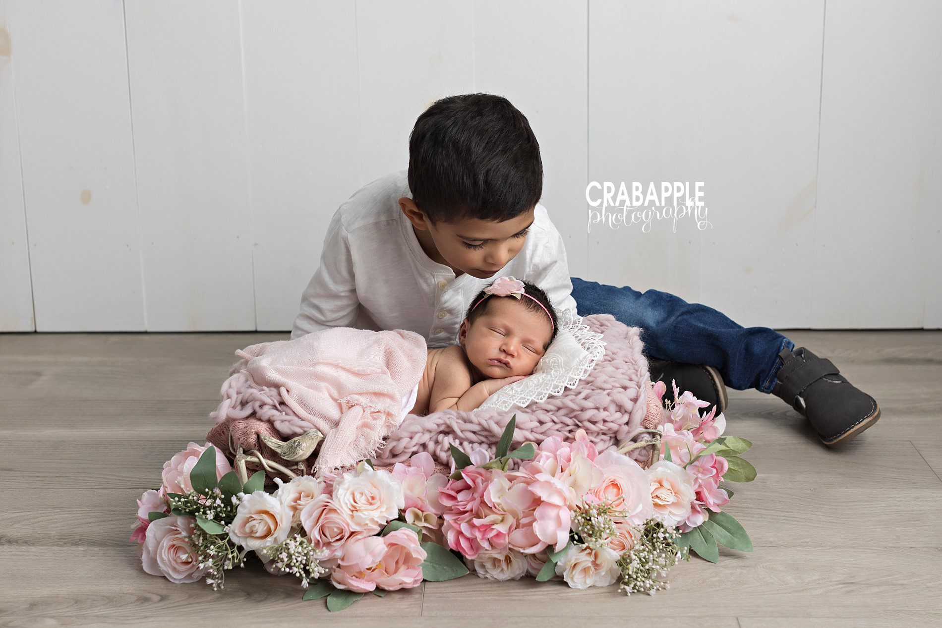 brother and sister photos with newborn baby