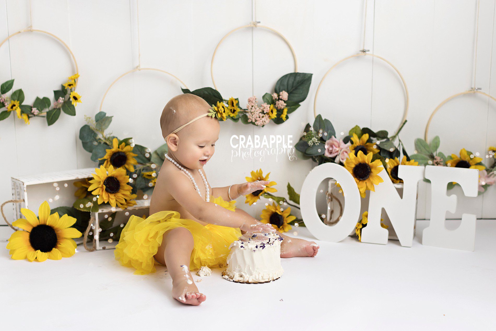 whimsical floral cake smash with sunflowers