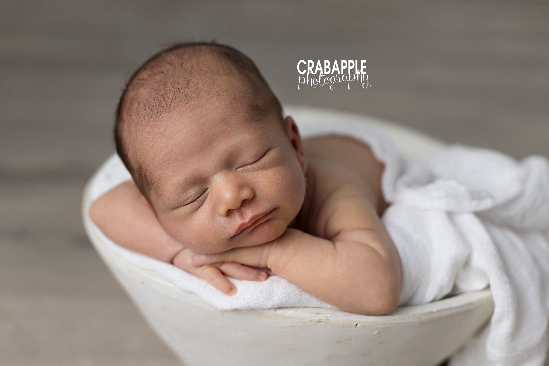 pose ideas for newborn photos using props