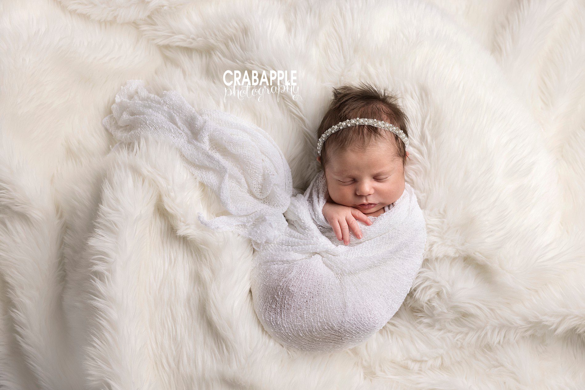 monochromatic white styling for newborn photos