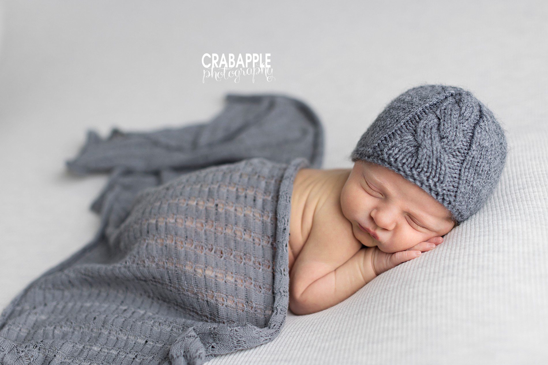 using gray knit hat and swaddle in newborn photos