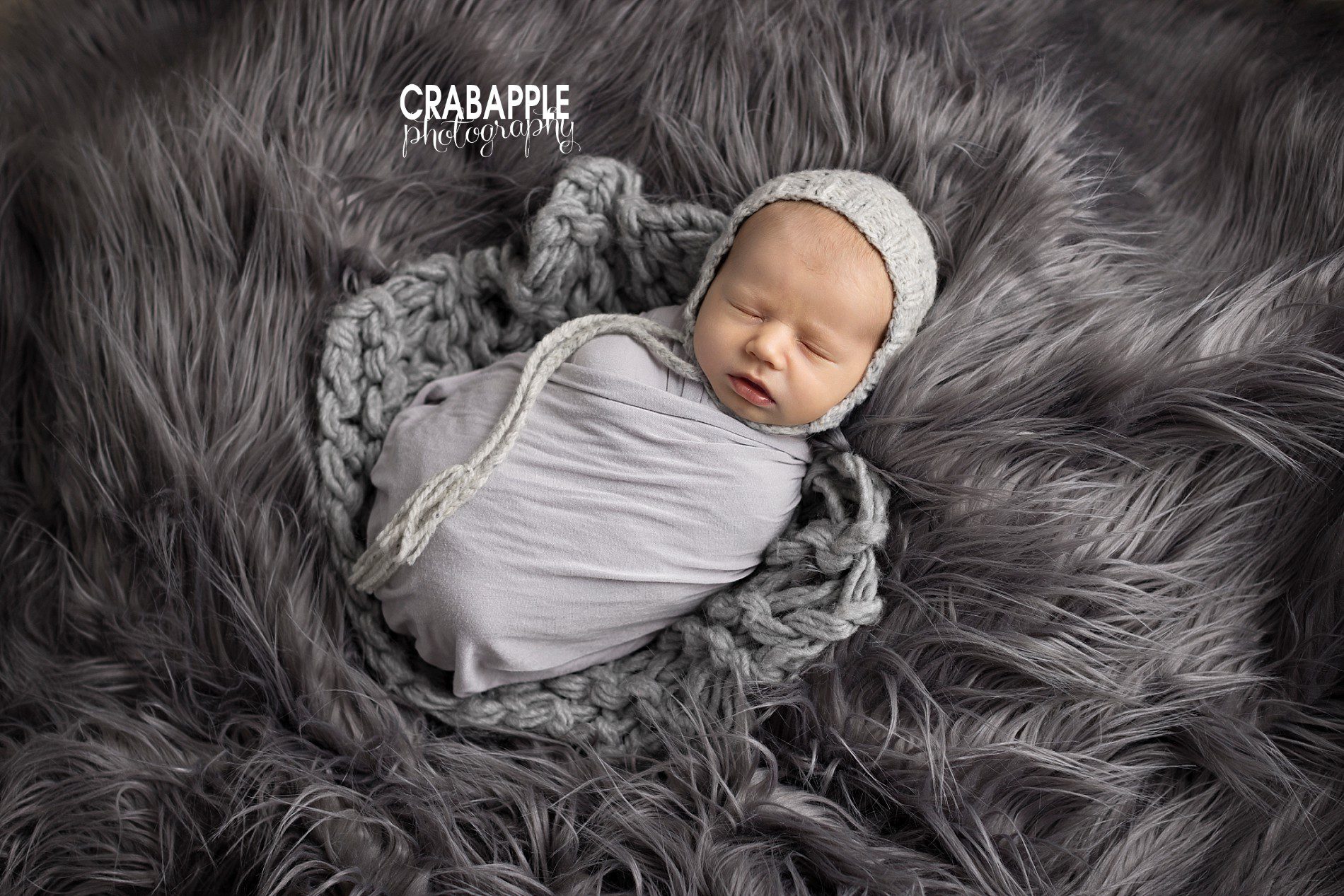 gray knit blanket and fur in newborn photos