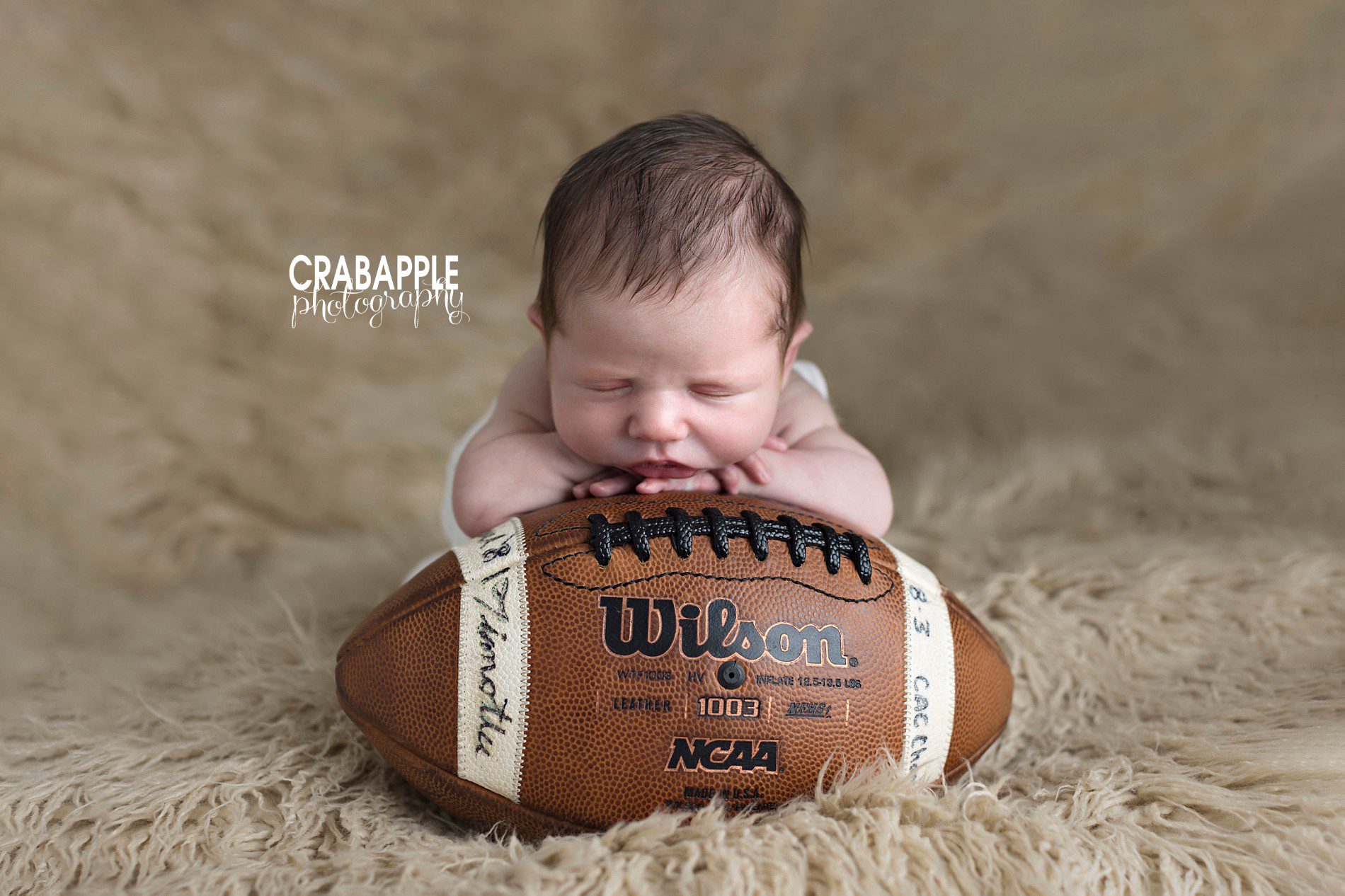 https://crabapplephotography.com/2024/01/19/sports-themed-newborn-photos/