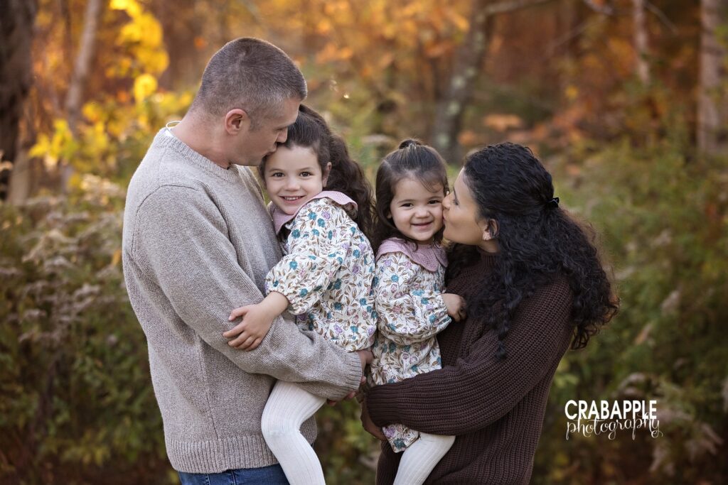 Family cuddle during fall outdoor portraits