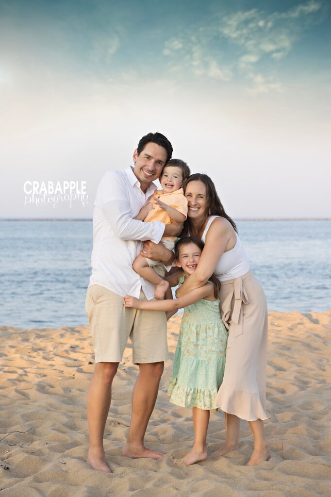 Beach family photo with a sweet group hug