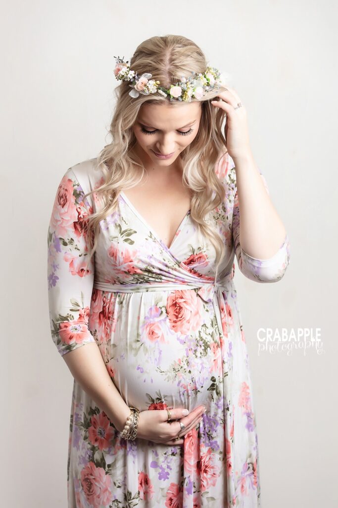 whimsical floral maternity poses for moms Boston
