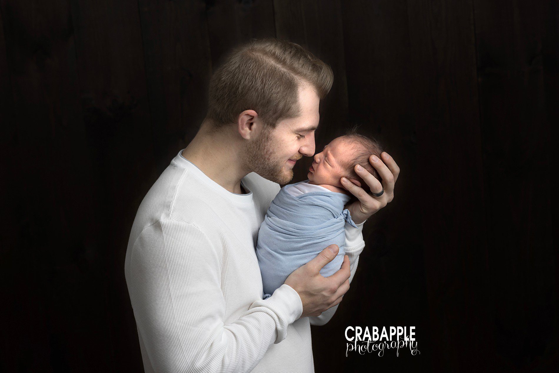 poses for father and son newborn photos