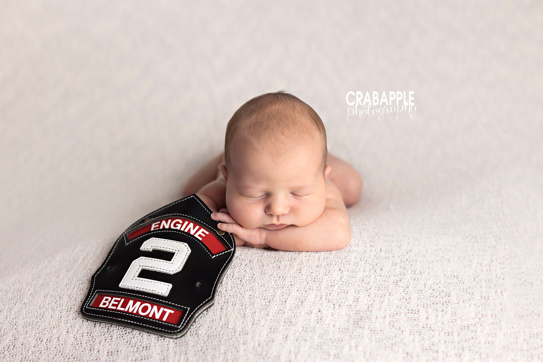 ideas for newborn photos with firefighter badge