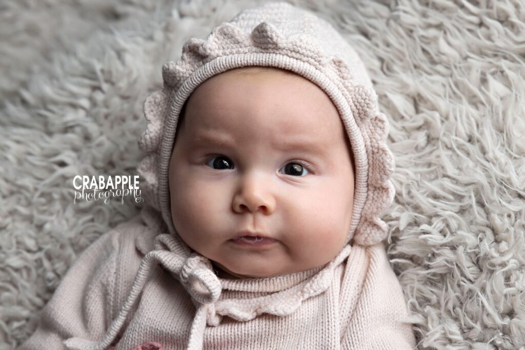 Neutral Baby Girl Photos Baby girl wearing neutral textured outfit during milestone photography session