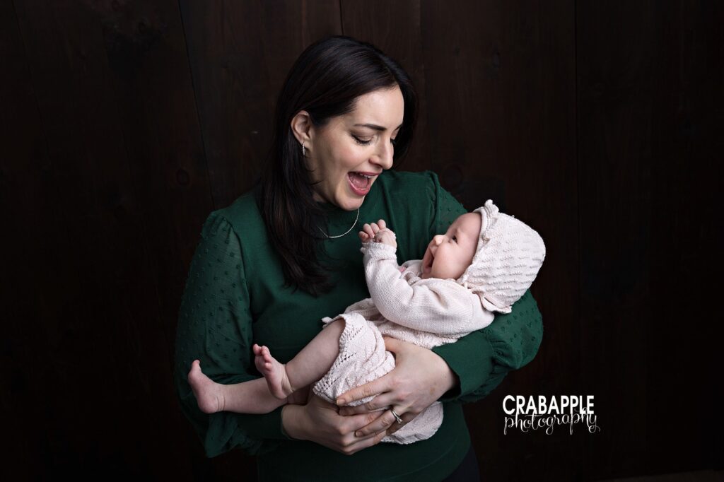 Mother and Daughter Portraits Mother cuddling 3 month old daughter during family session in Dracut