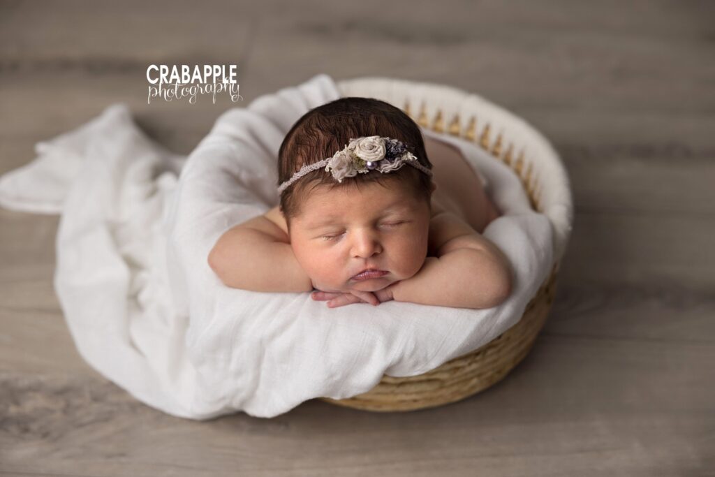 Cozy newborn baby in round basket – professional Boston newborn photographer
