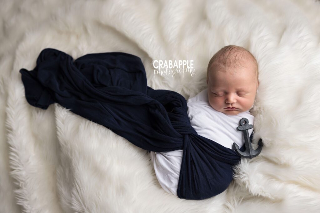 Nautical newborn photo newborn portrait using swaddle and tiny anchor accessory