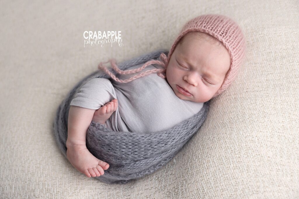 comfortable newborn positioning content sleeping baby swaddled with one leg out