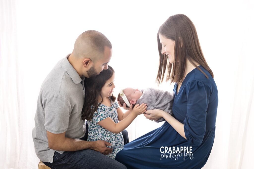 Family bonding with newborn – Boston lifestyle family photographer
