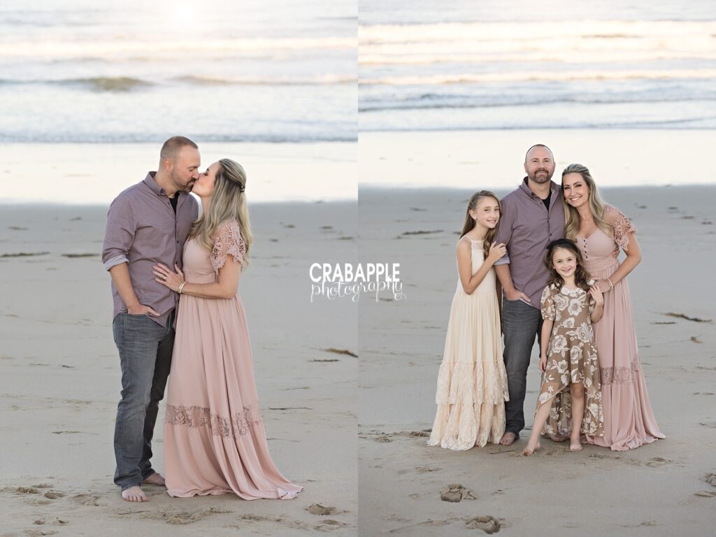 Parents laughing with daughters at shoreline during beach photos