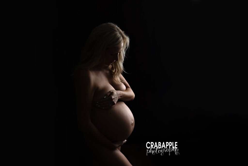 Dramatic and elegant ideas for maternity photos using interesting lighting techniques from a Southern New Hampshire maternity photographer