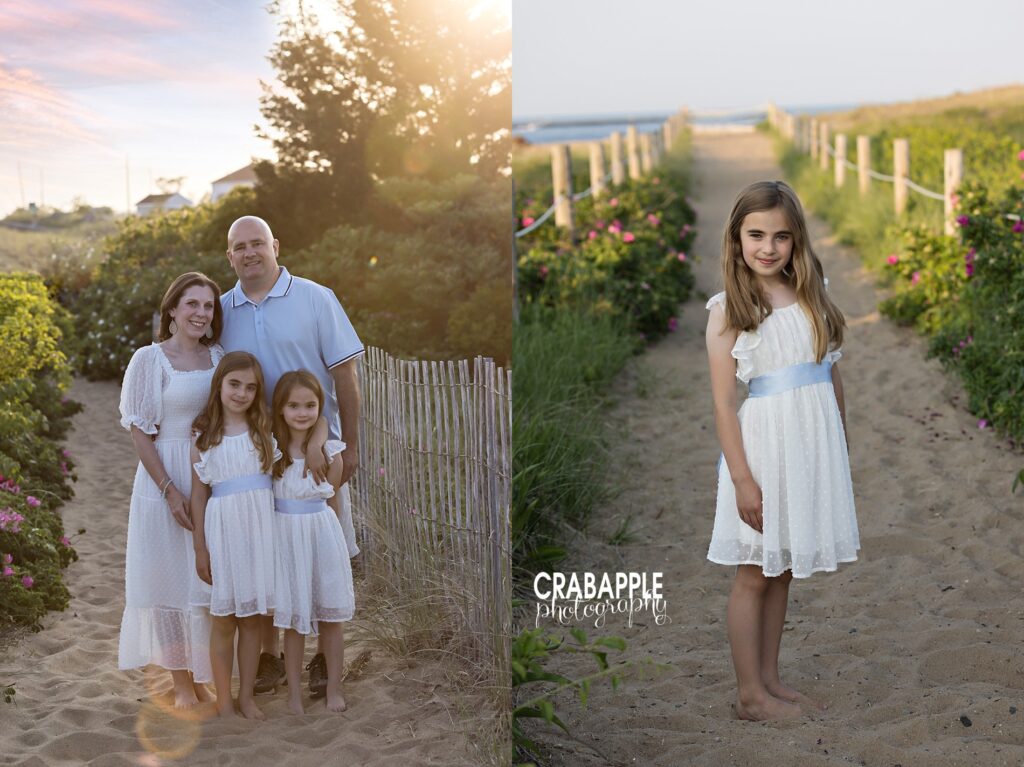 A family of four dress in coordinating outfits for beach family photos, using the white and blue color palette. The girls both wear white dresses with blue sashes.