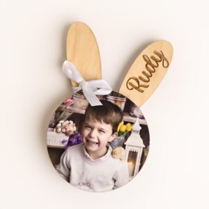Photo of an Easter customized wooden magnet in the shape of a bunny with child's name engraved on one ear and a photo attached