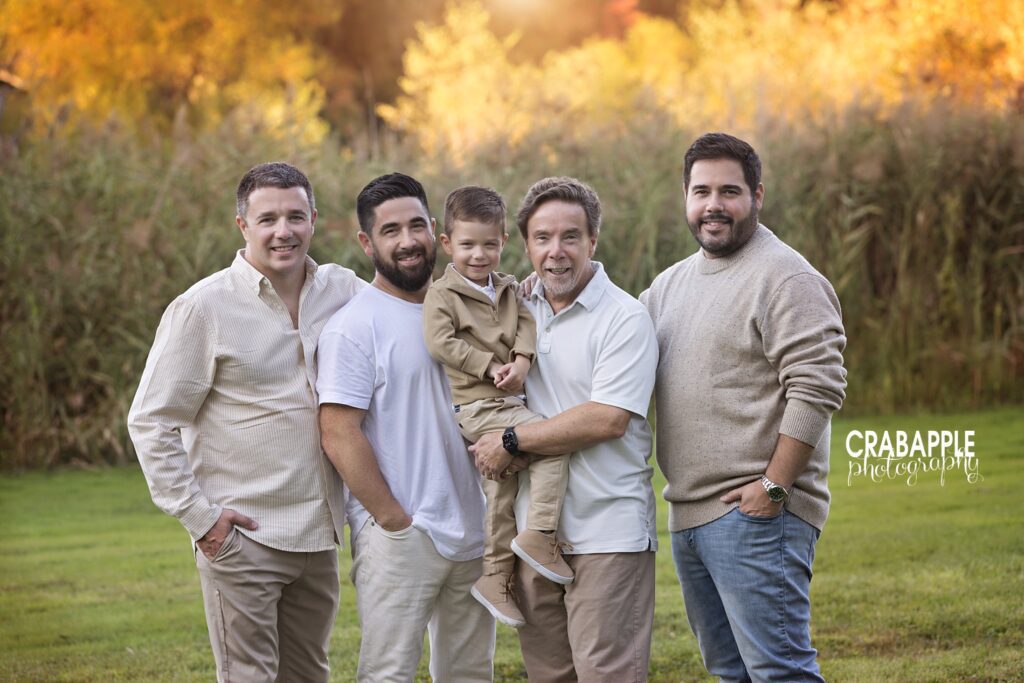 Boston area extended family photographed together in golden autumn light.
