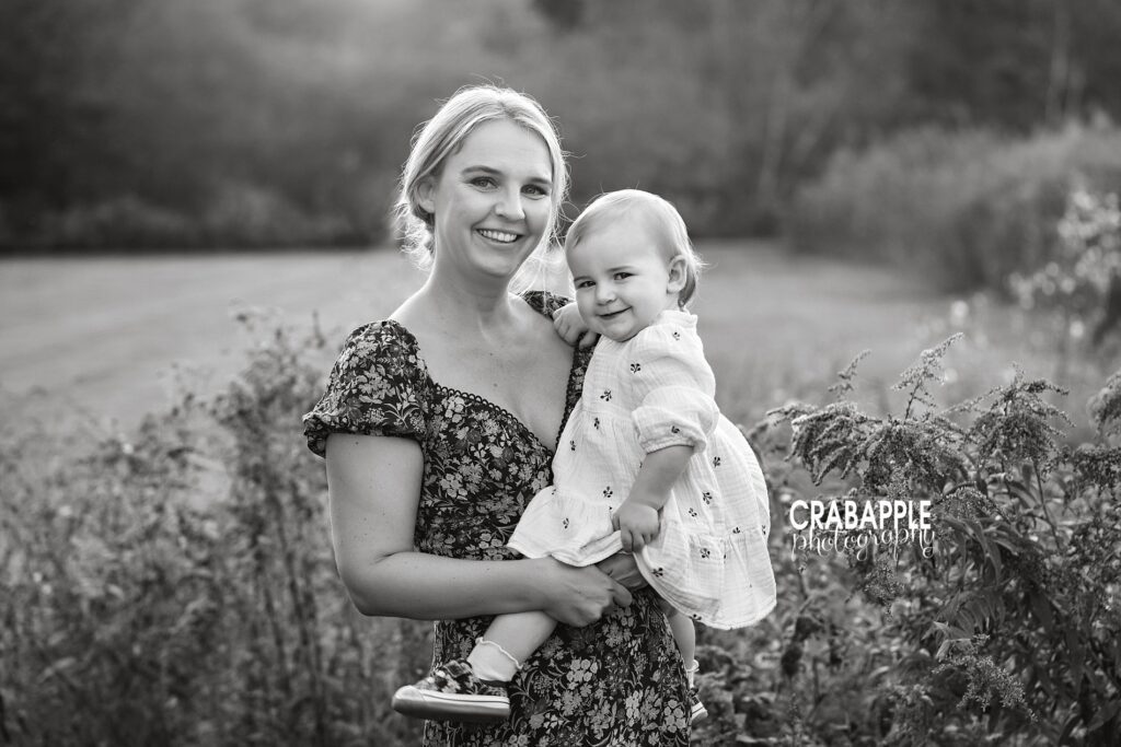 Black and white mother and baby photos A black and white portrait of a mom and 1 year old daughter during a fall family portrait session