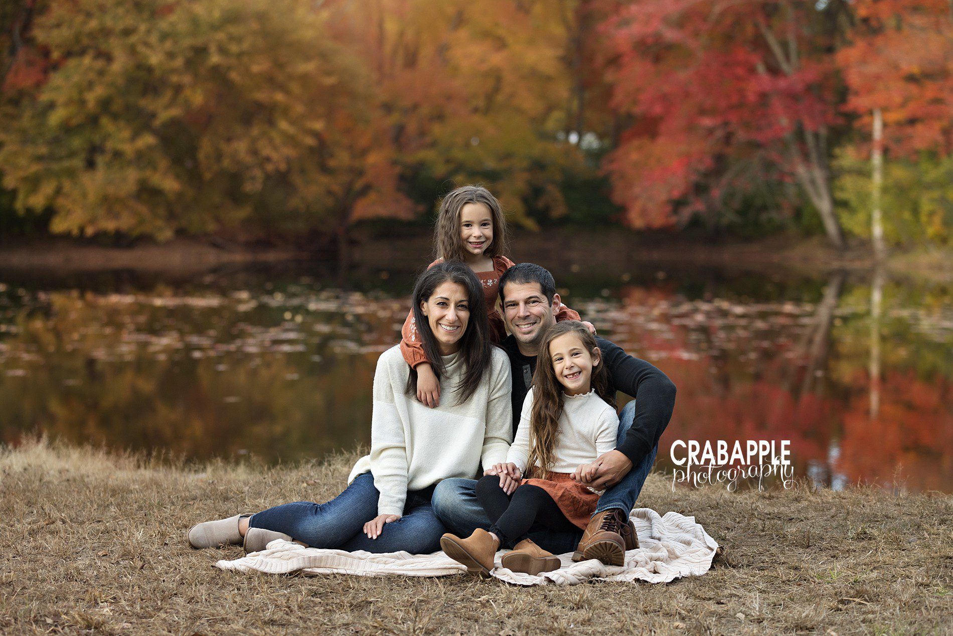 Family photo pose ideas North Shore MA, cozy sitting on ground pose
