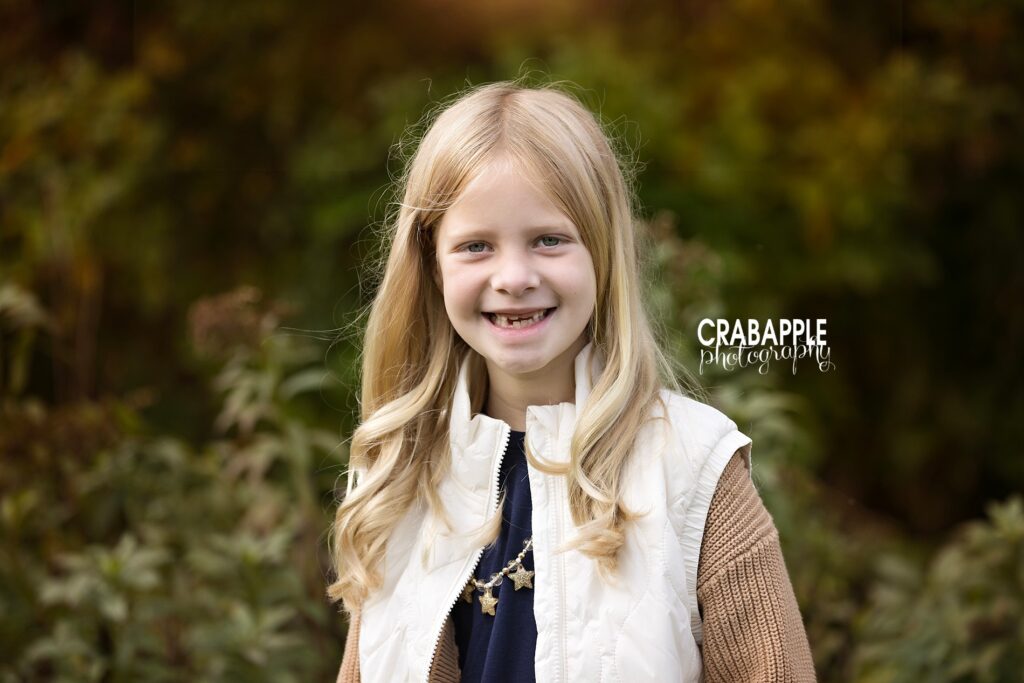 Close up portrait of a young girl during a Boston area outdoor fall family portrait session