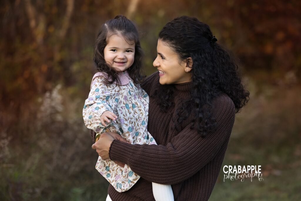 Candid moments during fall family photography in Andover MA Family shares candid laughs during fall family photography in Andover MA