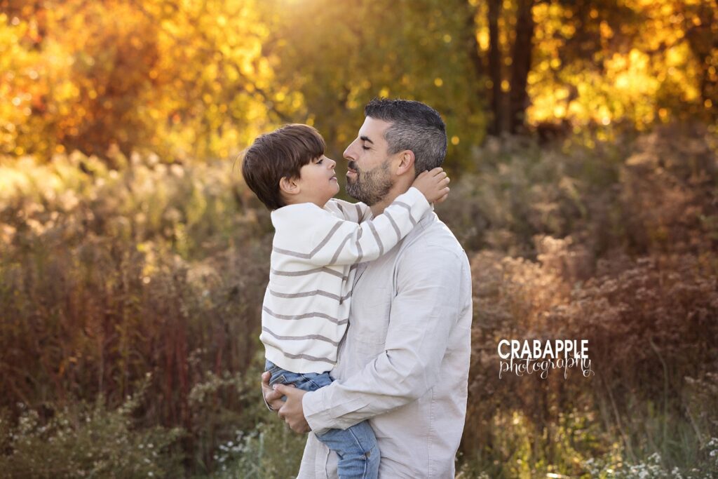 Father and son portraits A sweet candid moment captured between father and son during family photo session