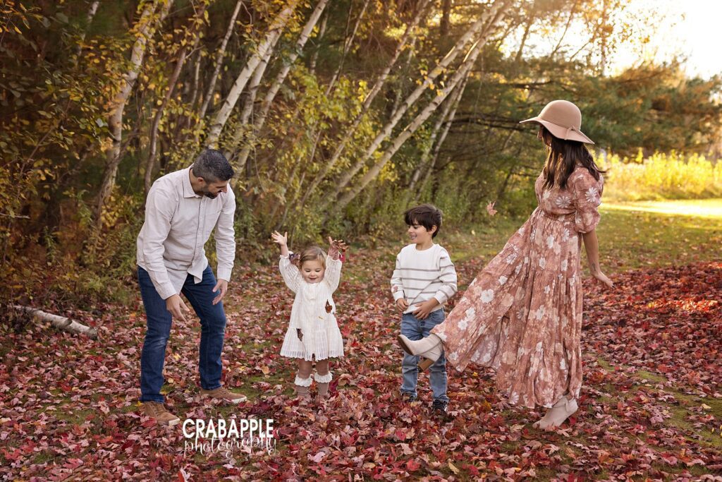 Fall family photos playing in leaves Fun ideas for family photos playing in leaves during the fall