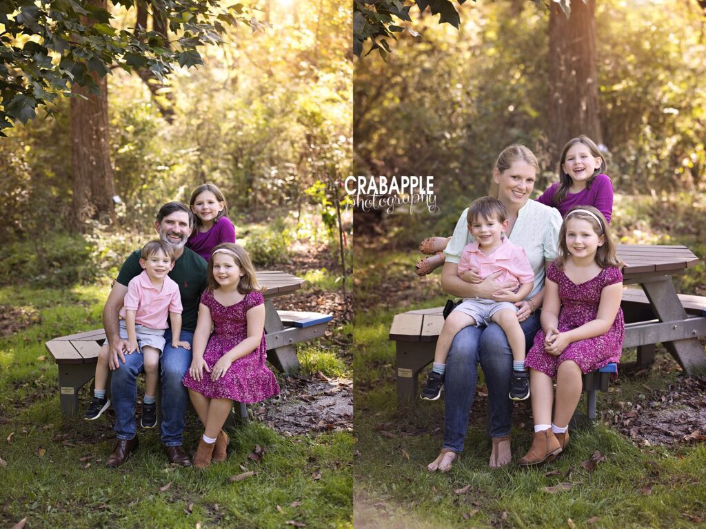 Family photos around a picnic table at Acton Arboretum