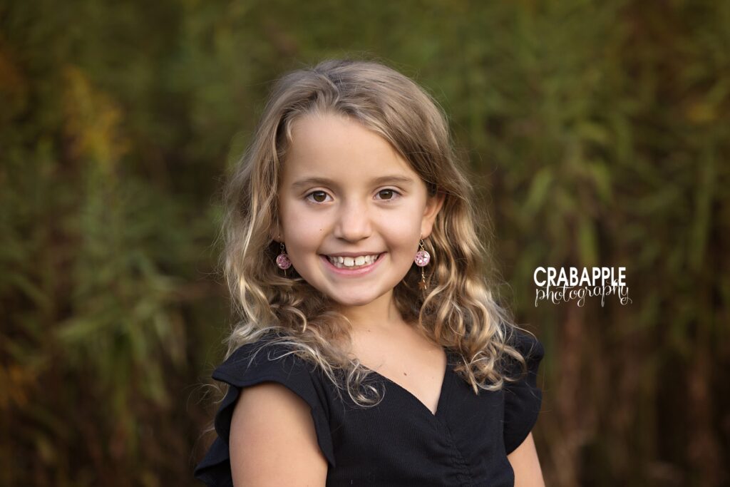 Newton MA Greater Boston Child portrait of a young girl smiling at the camera