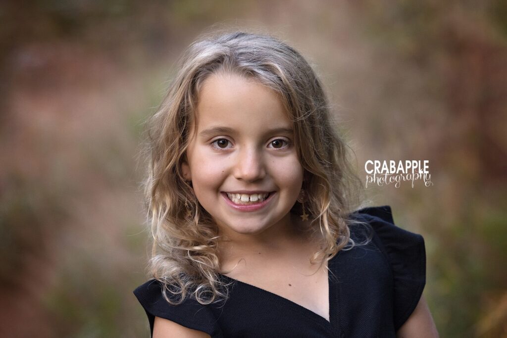A close up headshot portrait of a young girl