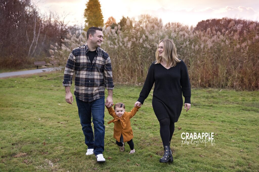 Tewksbury baby first birthday photos outdoors One year old baby girl celebrating milestone with fall portraits with parents at Tewksbury MA fall family photo session