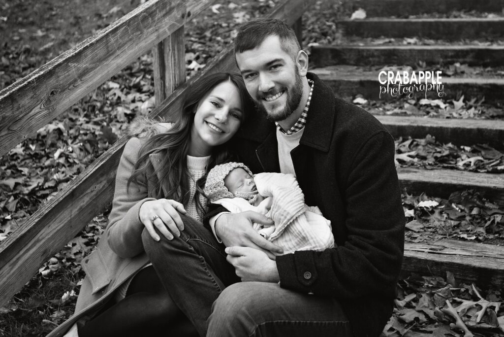 Black and white family portrait ideas with infant outside during winter