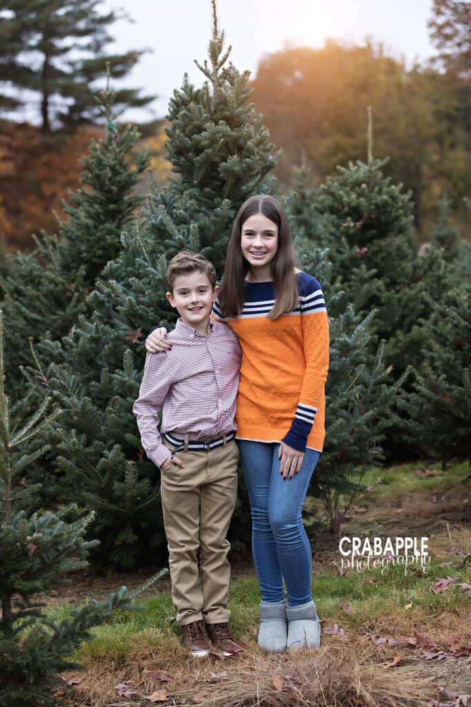 Brother and sister smiling together during holiday mini

