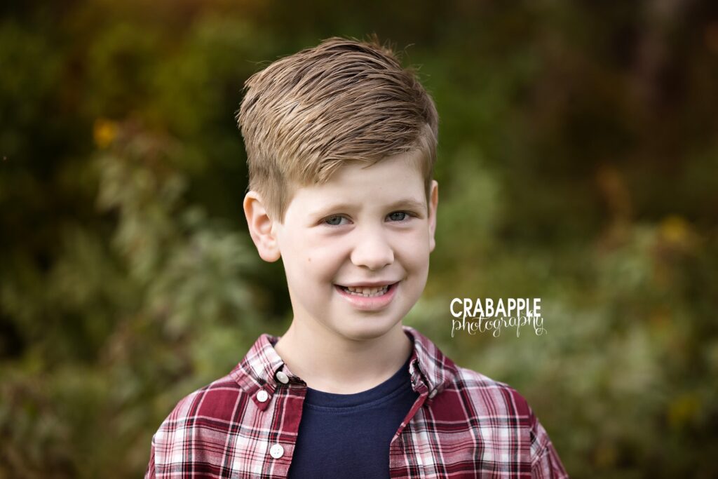 Close up portrait of a young boy during North Shore fall park session
