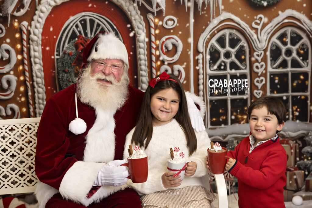 Brother and Sister share a hot cocoa with Santa