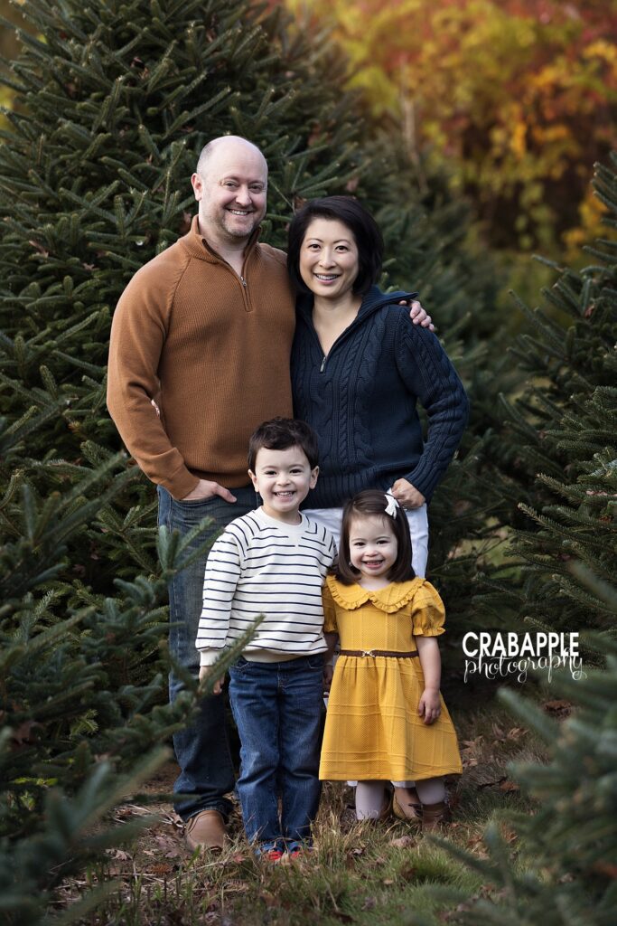 Holiday mini session outfit inspiration for family of four using navy, mustard, brown and white