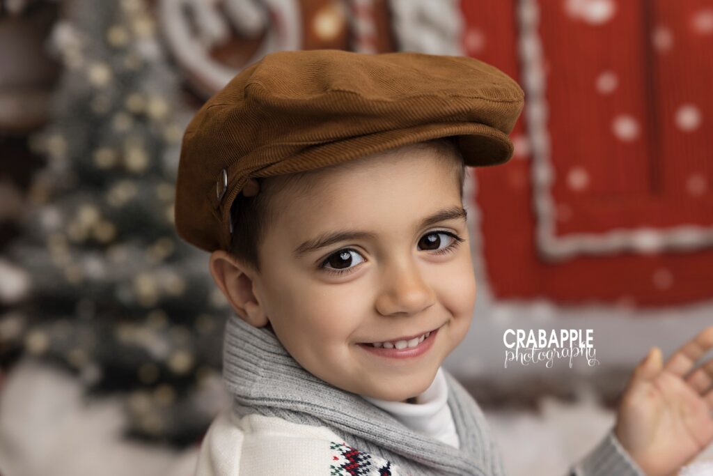 Close-up portrait of smiling boy during Christmas photo session
