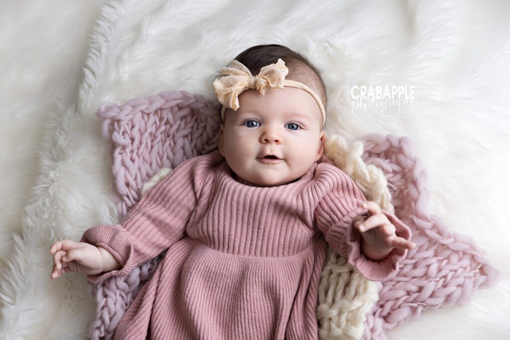 Professional baby photography Andover featuring smiling 3-month-old baby girl
