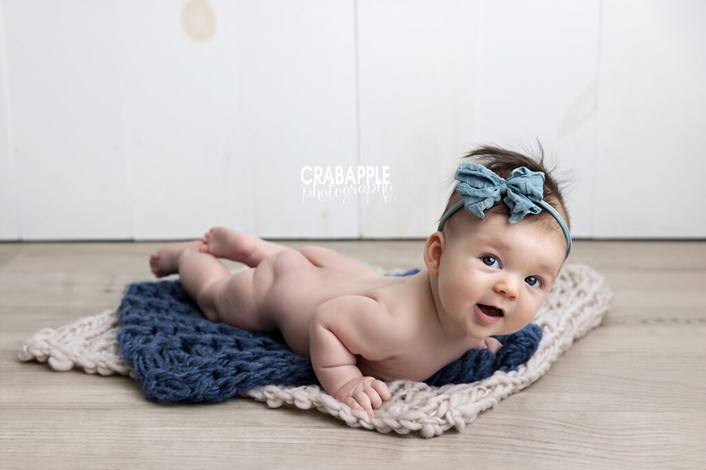 Using blue in baby girl milestone portraits near Andover MA