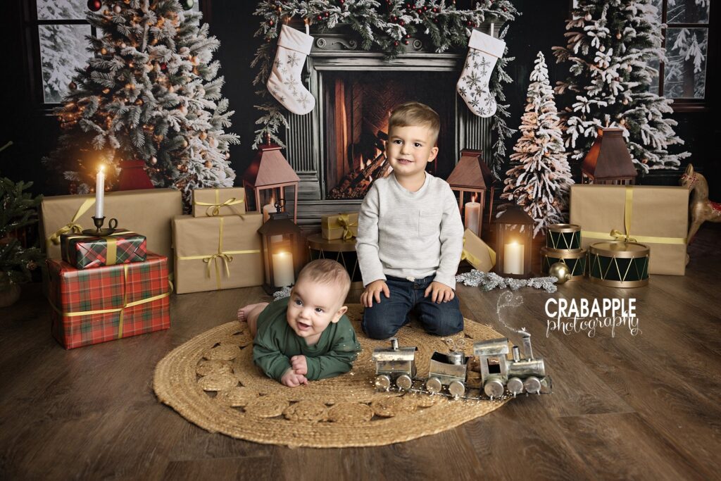 Brothers sitting together during festive Christmas mini session.
