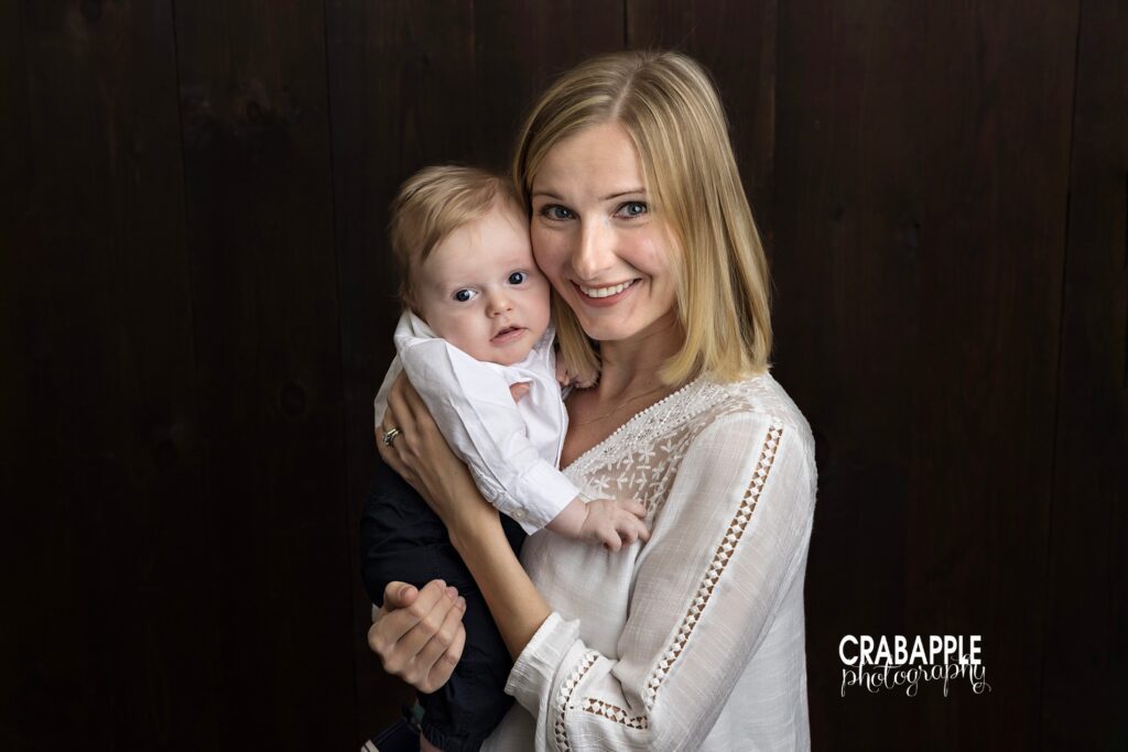 Close and emotional mother and newborn portrait in neutral colors
