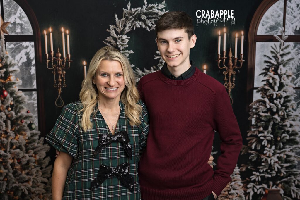 Mother poses with her teenage son during Boston area Christmas mini session