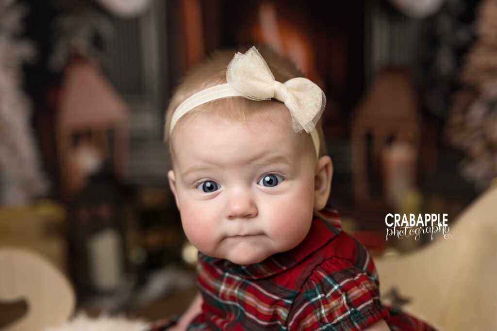 Portrait of a baby girl solo during family Christmas mini sessions