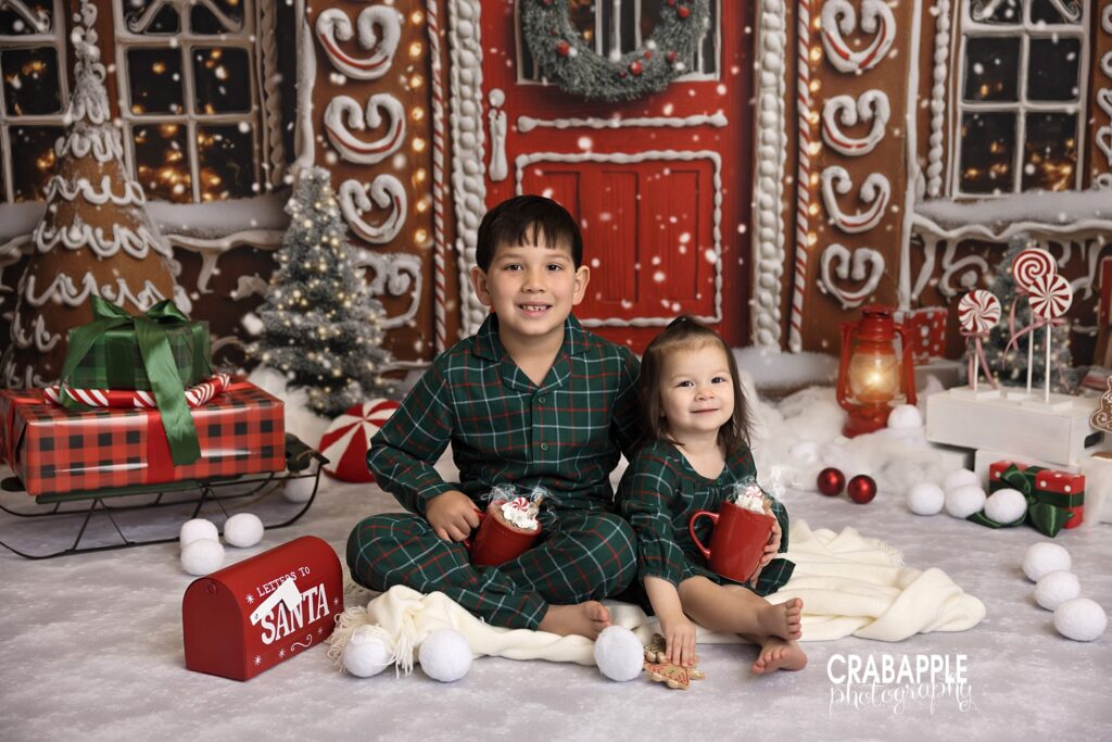 Brother and sister pose together on holiday set