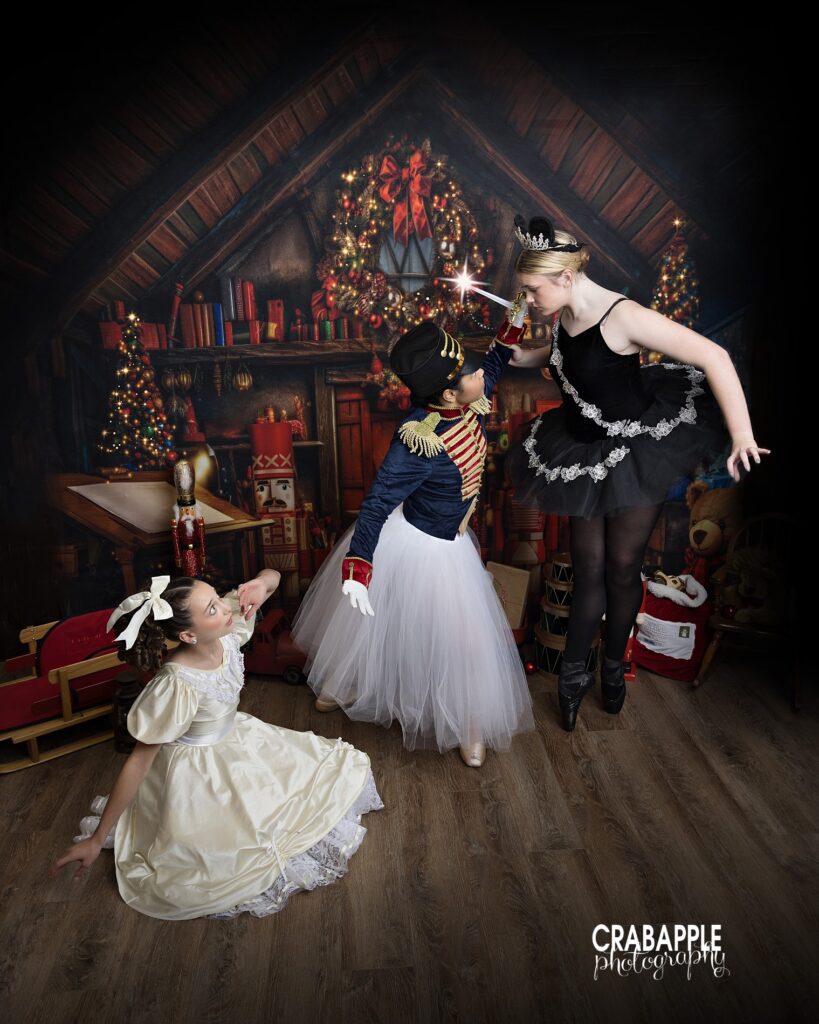 Trio of dancers recreating choreography on rustic toy shop set
